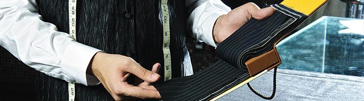 Bespoke Tailor Selecting Fabrics 718x200