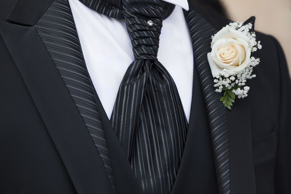 Boutonnière And A Diamond Stud On A Striped Tie