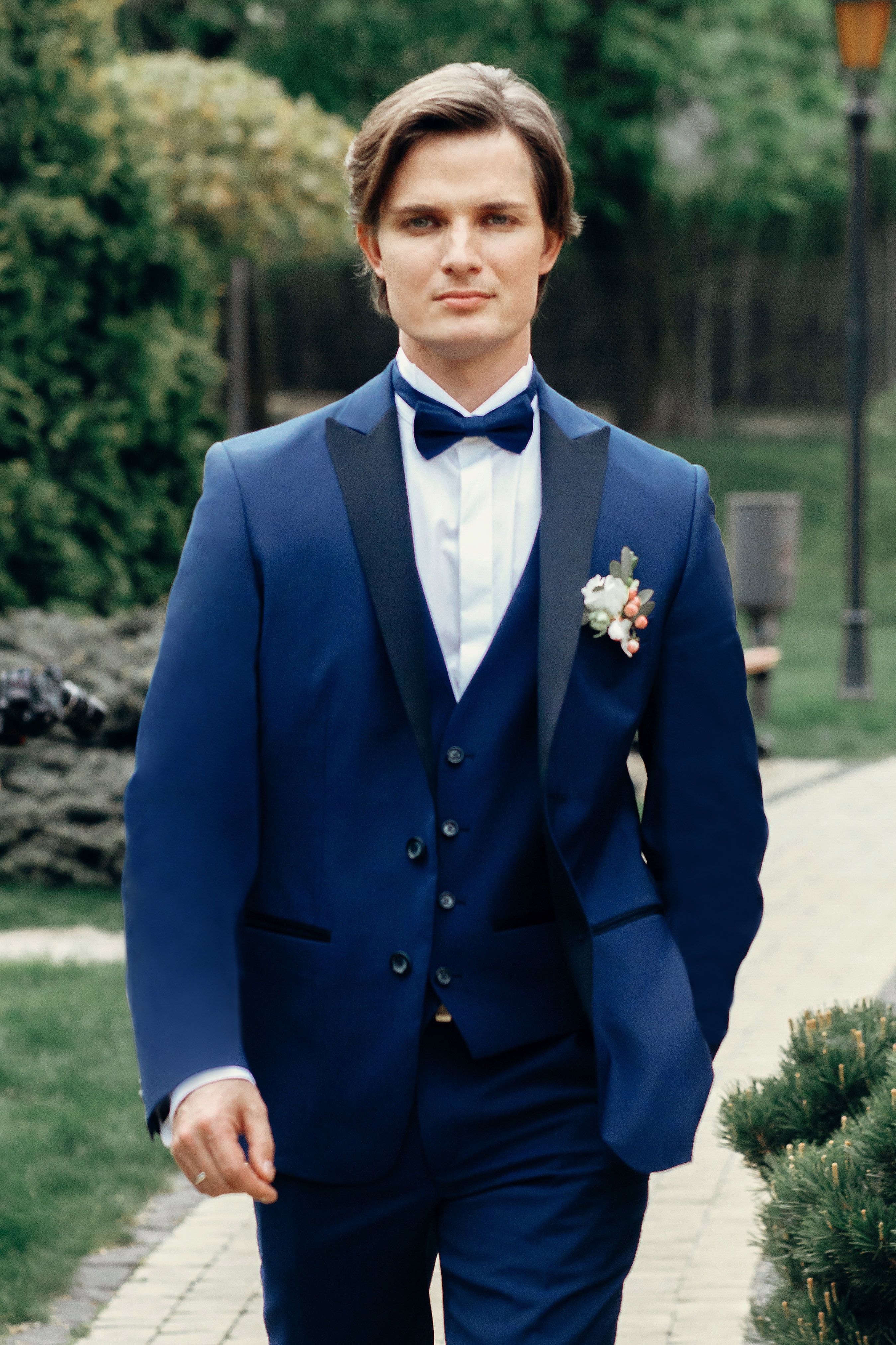 Groom Wears A Blue Three Piece Suit